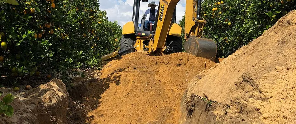 Excavating to install citrus irrigation systems in Florida.